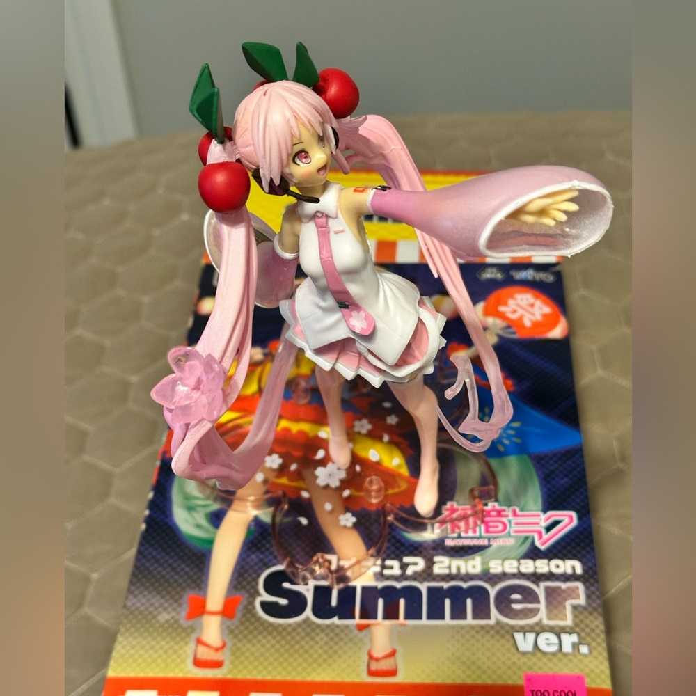 Pink Anime Figure with Cherry Accents